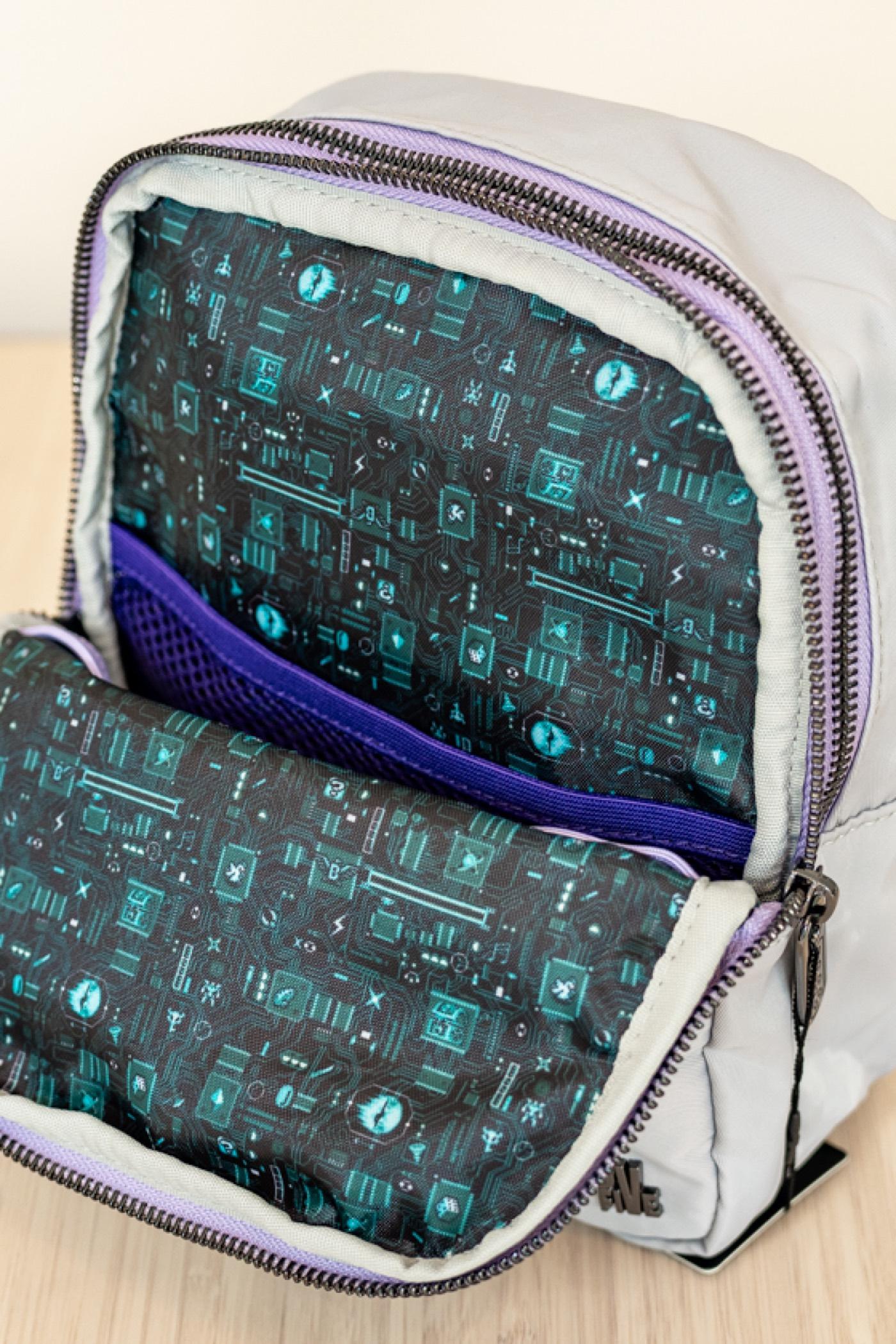 A Console Bag unzipped to show its circuit-board lining print